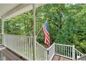Relaxing porch with a view of mature trees, perfect for enjoying the outdoors at 1341 Little Deer Run, Canton, GA 30114