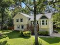 Attractive home featuring a well-maintained lawn and a front porch at 2208 Mountain Springs Nw Ct, Kennesaw, GA 30144