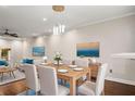 Open dining room with modern lighting, table seating for six, and artwork at 6 Alston Place Ne Ne Pl, Atlanta, GA 30324