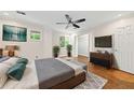 Cozy main bedroom features a ceiling fan, large windows, and modern decor at 6 Alston Place Ne Ne Pl, Atlanta, GA 30324