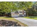 Lovely two-story home with a two-car garage and well-maintained lawn and landscaping at 2505 Hamilton Parc Ln, Buford, GA 30519