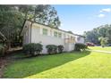 Well-manicured front yard with a one-story home, green trees, and a nice driveway at 3436 Adkins Nw Rd, Atlanta, GA 30331