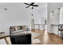 Open-concept living area with hardwood floors, high ceilings, and contemporary decor at 11739 Sawgrass Ct, Fayetteville, GA 30215