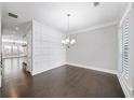 Dining room featuring beautiful dark hardwood floors and modern chandelier at 1618 Durden Ne Rd, Atlanta, GA 30319