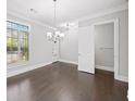 Bright dining room with hardwood floors, large window and view to the outside at 1618 Durden Ne Rd, Atlanta, GA 30319