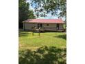 Cozy backyard with a fenced-in area and a deck, offering a private outdoor space at 393 W Freeman St, Maysville, GA 30058