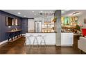 Modern kitchen with white cabinets, a large center island with seating, and stainless steel appliances at 145 15Th Ne St # 826, Atlanta, GA 30309