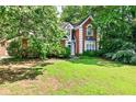 Charming brick home featuring a well-manicured lawn and mature trees in a desirable neighborhood at 2866 Wynford Sw Dr, Marietta, GA 30064
