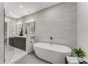 Modern bathroom features a soaking tub, walk-in shower, and large vanity with double sinks at 1099 North Ne Ave # 12, Atlanta, GA 30307