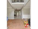 Wide open foyer space with a view to the back of the house and the fireplace at 4467 Boatmans Cv, Stone Mountain, GA 30083