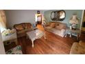Formal living room with hardwood floors, ornate furniture, and decorative mirrors at 1712 Clifton Se Way, Atlanta, GA 30316