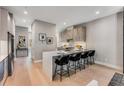 This kitchen has a large island with bar stool seating and modern finishes with an open floor plan at 1099 North Ne Ave # 13, Atlanta, GA 30307