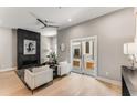 Bright and airy living room with a modern fireplace, ceiling fan, and large sliding glass doors at 1099 North Ne Ave # 13, Atlanta, GA 30307