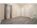 Spacious bedroom featuring hardwood floors, neutral walls and a large window providing natural light at 734 Celeste Sw Ln # 84, Atlanta, GA 30331