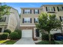 Charming townhome with brick accents, attached garage, manicured landscaping, and inviting front entrance at 734 Celeste Sw Ln # 84, Atlanta, GA 30331
