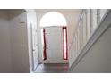 Bright foyer with hardwood floors and stairway at 11854 Registry Blvd, Hampton, GA 30228