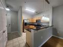 Well-lit galley kitchen with stainless steel appliances and pendant lighting at 870 Mayson Turner Nw Rd # 1228, Atlanta, GA 30314
