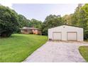 Property with home and a large outbuilding, providing ample storage at 5670 Lanny Dr, Powder Springs, GA 30127