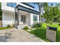 Front porch view showcasing a modern black and white color scheme at 833 Humphries Sw St, Atlanta, GA 30310