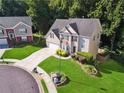 Aerial view of a brick home showing a well-maintained lawn and cul-de-sac at 1343 Cartwright Ln, Lawrenceville, GA 30045