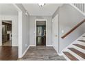 Inviting foyer with wood-look flooring and view of staircase and living area at 1343 Cartwright Ln, Lawrenceville, GA 30045