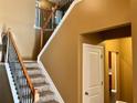 Carpeted stairs with wooden banister and metal spindles lead to the upper level at 1854 Caswell # 56, Marietta, GA 30060