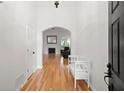 Bright foyer with hardwood floors, white walls, and an arched doorway leading to the living area at 1805 Wilkenson Xing, Marietta, GA 30066