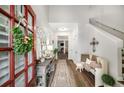 Inviting entryway with hardwood floors, console table, bench, and bright, neutral decor at 1024 Brownstone Dr # 2, Marietta, GA 30008