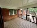 Relaxing screened porch offering a seamless transition to the deck at 25 Gladstone Sw Dr, Marietta, GA 30060