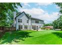 Expansive backyard with well-maintained lawn and patio, offering plenty of space for outdoor living at 2373 Oak Falls Ln, Buford, GA 30519