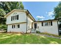 Charming two-story home with a well-manicured lawn and classic curb appeal at 5347 Ocarol Ct, Stone Mountain, GA 30088