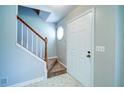 Welcoming entryway featuring a staircase and a side window that provides great light at 2161 Denson Sw Ln, Marietta, GA 30008