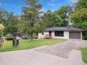Charming single-story home with painted brick and landscaped front yard at 5207 White Sw Blvd, Mableton, GA 30126