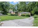 Cozy brick home with mature trees in a serene, wooded setting at 1279 Kenilworth Sw Dr, Atlanta, GA 30310