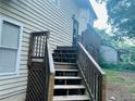 Exterior steps leading to the entrance of a two-story home with vinyl siding at 4007 Stacy Ln, Snellville, GA 30039