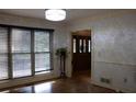Cozy living room with hardwood floors and large windows with light filtering shades at 4640 Calleigh Way, Snellville, GA 30039