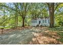 Charming home with a lovely front yard and mature trees, creating a serene setting at 1324 Almont Sw Dr, Atlanta, GA 30310