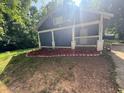 The home's front yard, showcasing fresh mulch and decorative rock edging around the foundation at 1116 Northwest Nw Dr, Atlanta, GA 30318