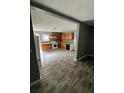 Modern kitchen features wood cabinets, white appliances, and sleek wood-look flooring at 4402 Highland Rd, Decatur, GA 30035