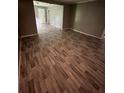 Spacious living room features modern wood-look flooring and neutral wall color at 4402 Highland Rd, Decatur, GA 30035