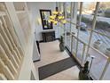 Grand lobby with high ceilings, elegant chandelier, and floor-to-ceiling windows offering natural light at 2479 Peachtree Road Northeast Ne Rd # 402, Atlanta, GA 30305