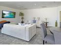 Bright community lounge area featuring comfortable seating and a large-screen TV for relaxation and entertainment at 2479 Peachtree Road Northeast Ne Rd # 402, Atlanta, GA 30305