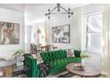 Stylish living room featuring a plush green sofa, modern lighting, and contemporary artwork at 200 B Reinhardt Se St, Atlanta, GA 30312