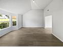 Spacious and bright living room featuring vaulted ceilings and large windows at 2226 Exchange Se Pl, Conyers, GA 30013