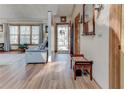 Bright entryway featuring hardwood floors, a bench, and an open view into the adjacent living area at 730 Ponderosa Ct, Fayetteville, GA 30214