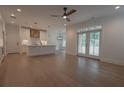 Spacious living room featuring an open floor plan with hardwood floors and contemporary finishes throughout at 3007 Holly St, Canton, GA 30115