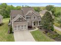 Beautiful home with a well-manicured lawn, landscaping, and attached garage at 44 Kingsford Xing, Acworth, GA 30101
