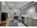 Updated kitchen featuring stainless steel appliances, shaker cabinets, and a stylish subway tile backsplash at 138 Elysian Nw Way, Atlanta, GA 30327