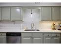 Updated kitchen featuring stainless steel appliances, shaker cabinets, and a stylish subway tile backsplash at 138 Elysian Nw Way, Atlanta, GA 30327