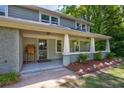 Close up of the home's front porch and landscaping details at 174 Rivertown Rd, Fairburn, GA 30213